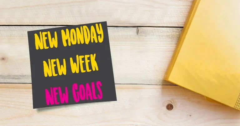 "New week new goals" written on a piece of black paper